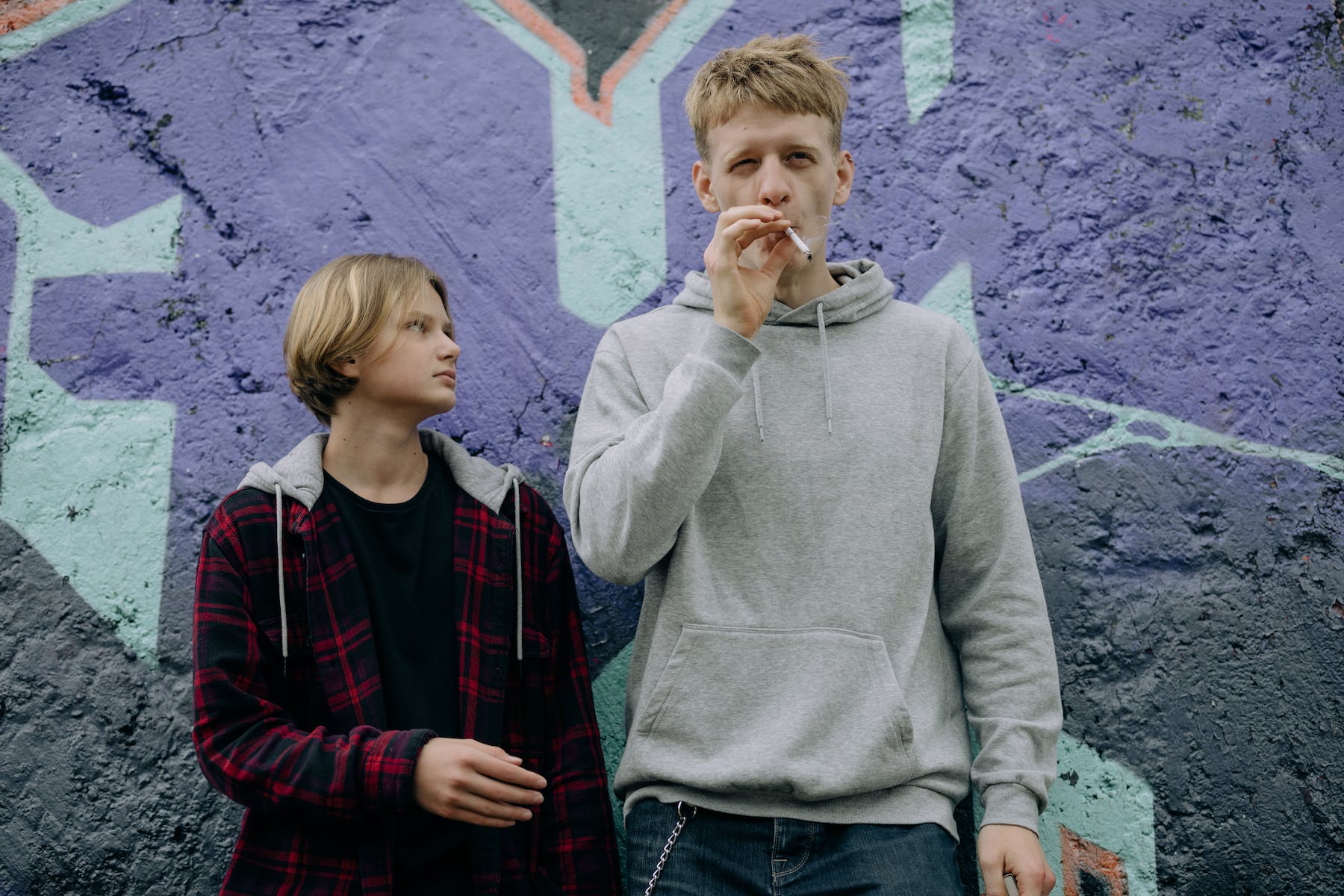 Young Men Smoking Together