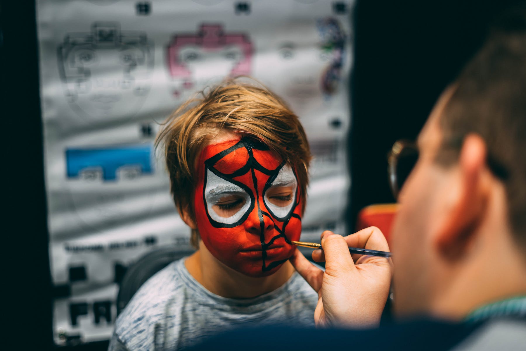 Man Painted Boy's Face